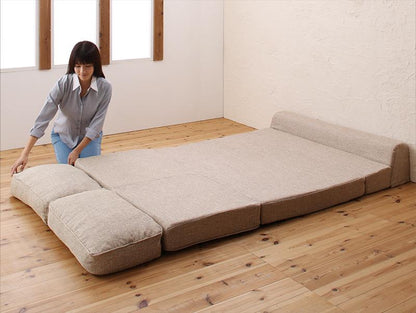 腰を支える 幅120cm 3WAYフロアソファベッド ベッドへ広げる様子